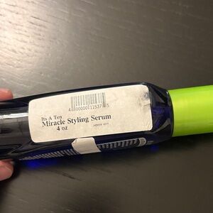 It's a 10 Miracle Styling Serum with Green Cap